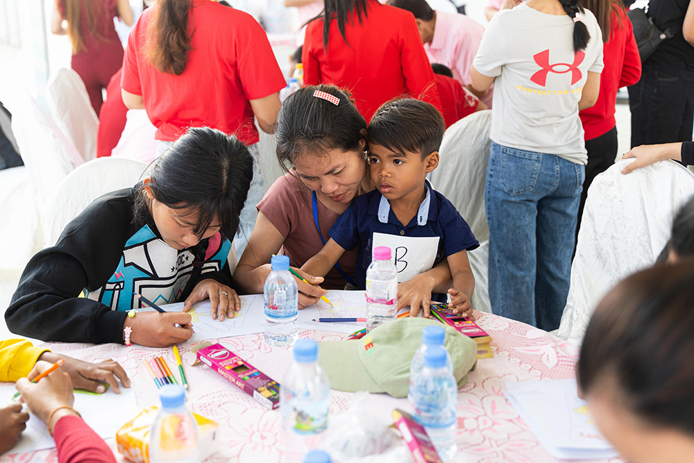 Parent-child bonding during a Family Day event in a factory in Cambodia, 2024